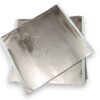 Light champagne silver foil sheet lifted from tissue-interleaved booklet