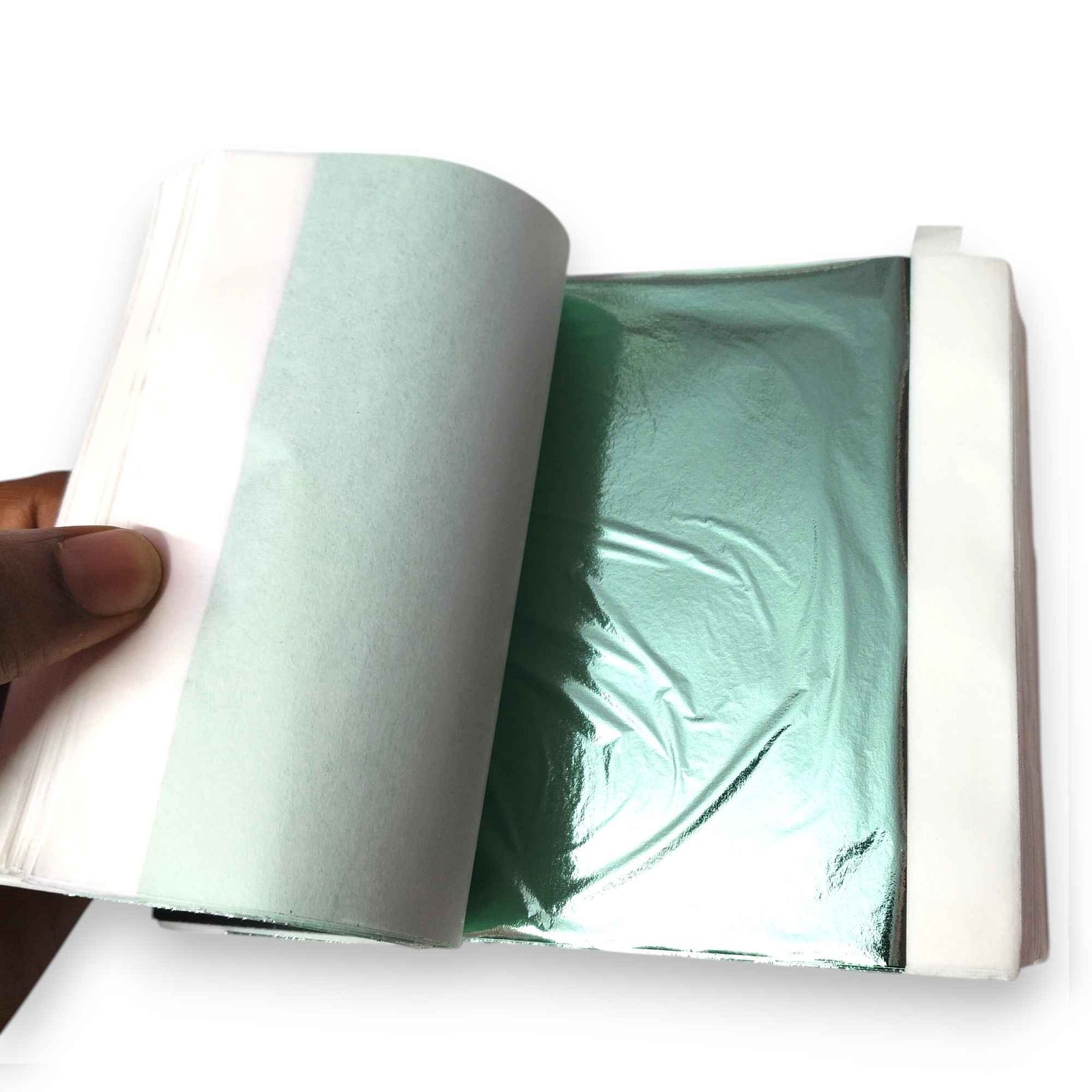 Open booklet of light green gold leaf foil sheets showing mint metallic shine