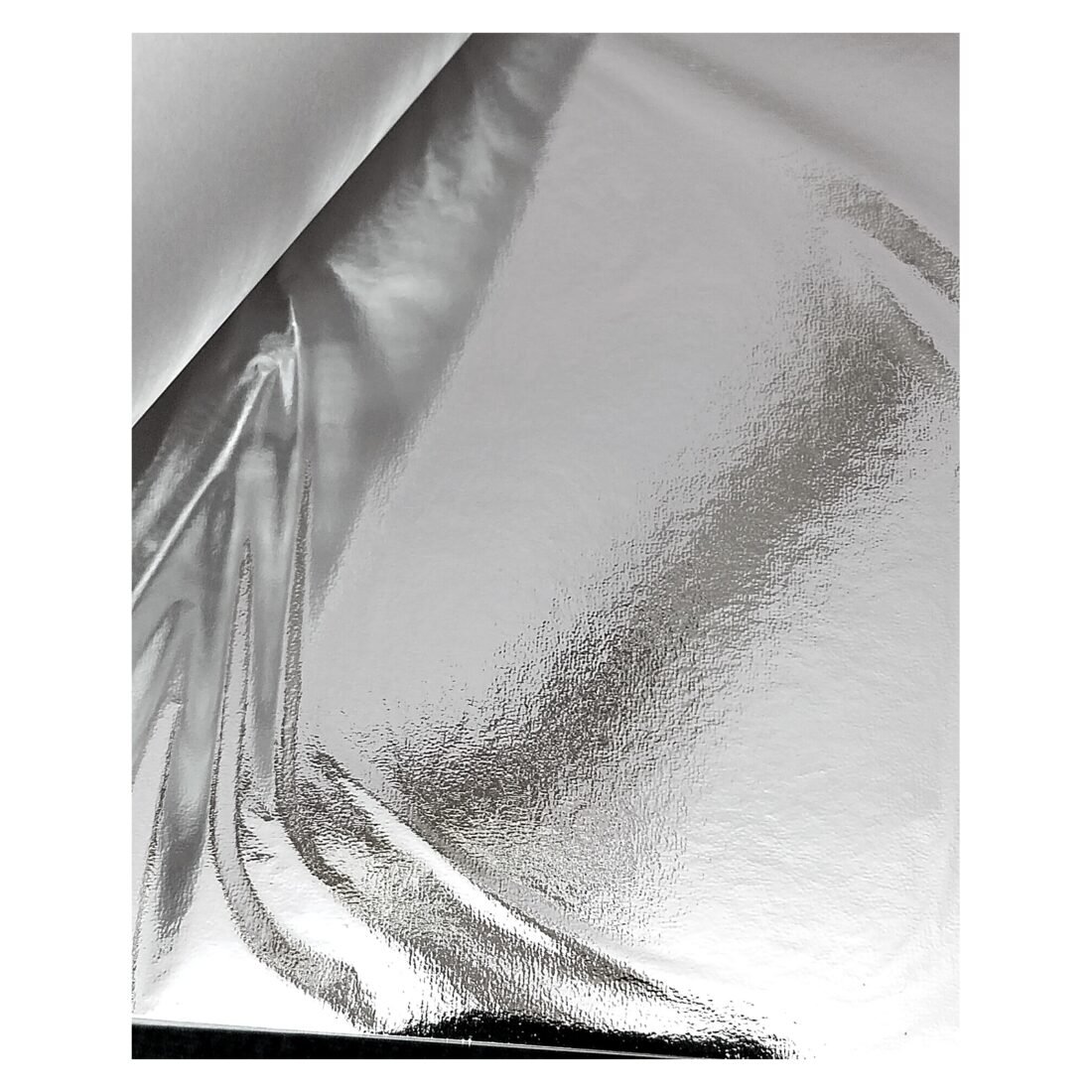 Silver leaf foil sheets interleaved with protective tissue paper
