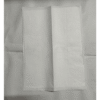 Closed silver leaf booklet in tissue paper wrapping