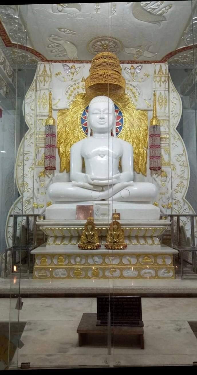 Gold leafing on marble Tirthankar murti bhamandal and chhatra
