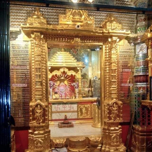 Complete gold leafing on mandir garbhagriha entrance and pillars