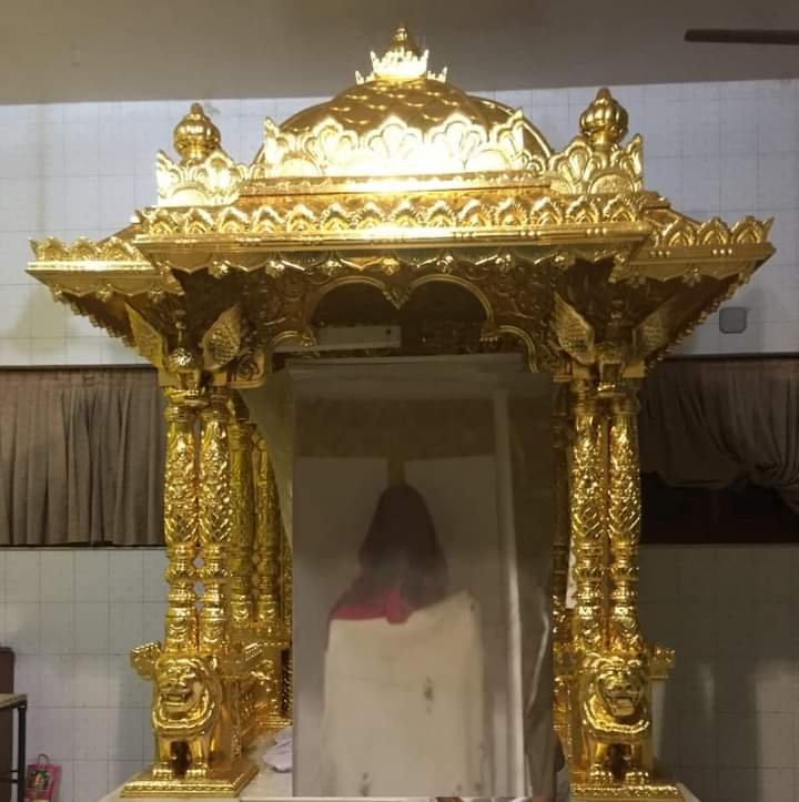 Gold leafing on carved mandir chhatri dome and pillars