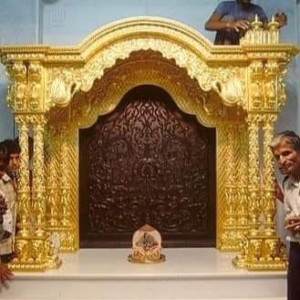 Sumera Warq karigars doing gold leaf work on mandir singhasan frame