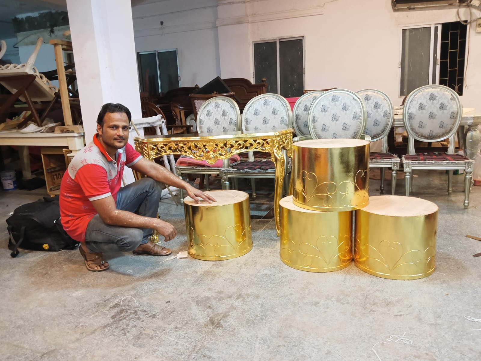 Sumera Warq karigar with gold leafed console table and round tables