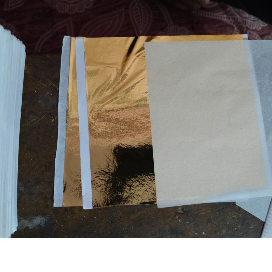 Gold leaf foil sheets 14x14 cm separated by tissue paper