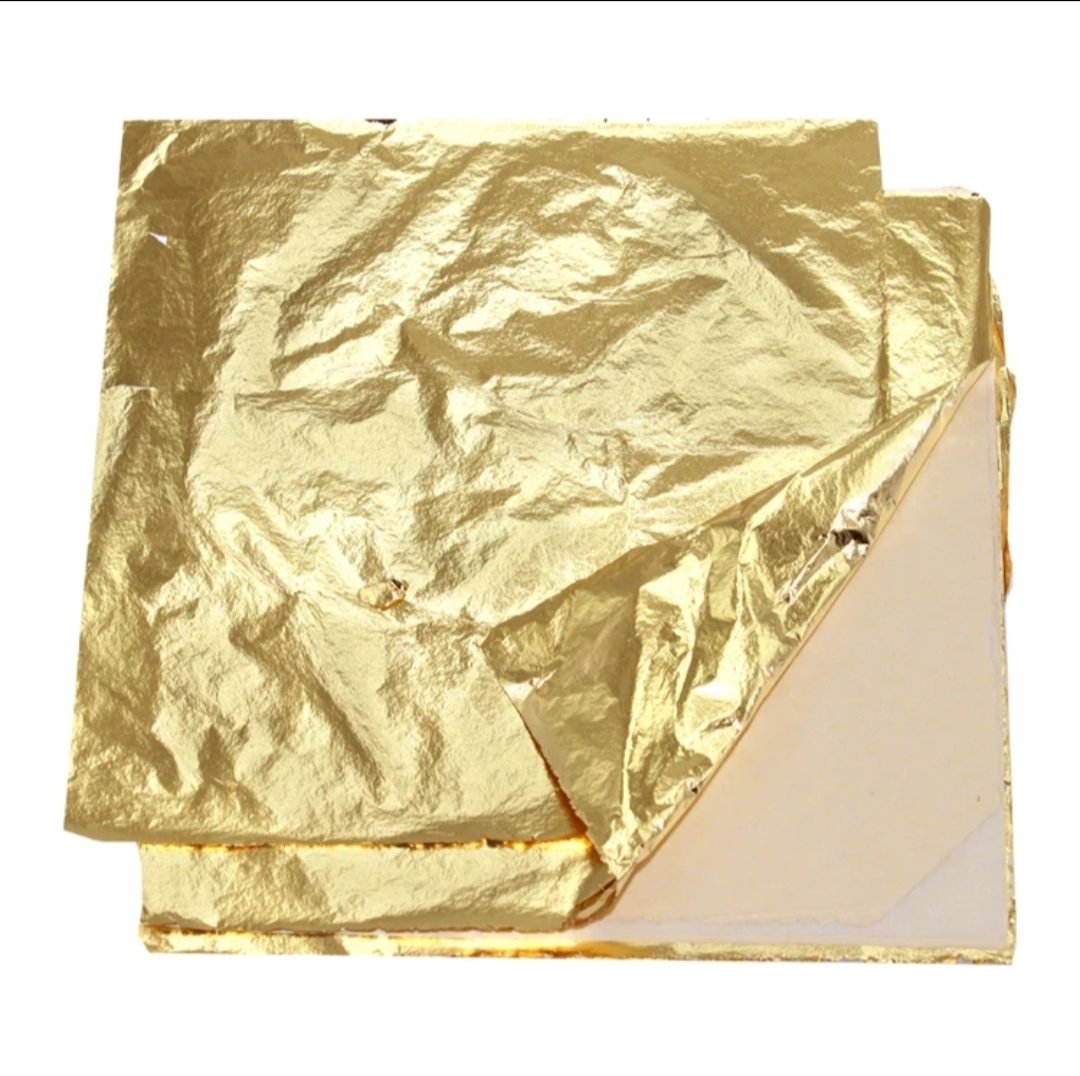 Stack of gold leaf foil sheets 16x16 cm