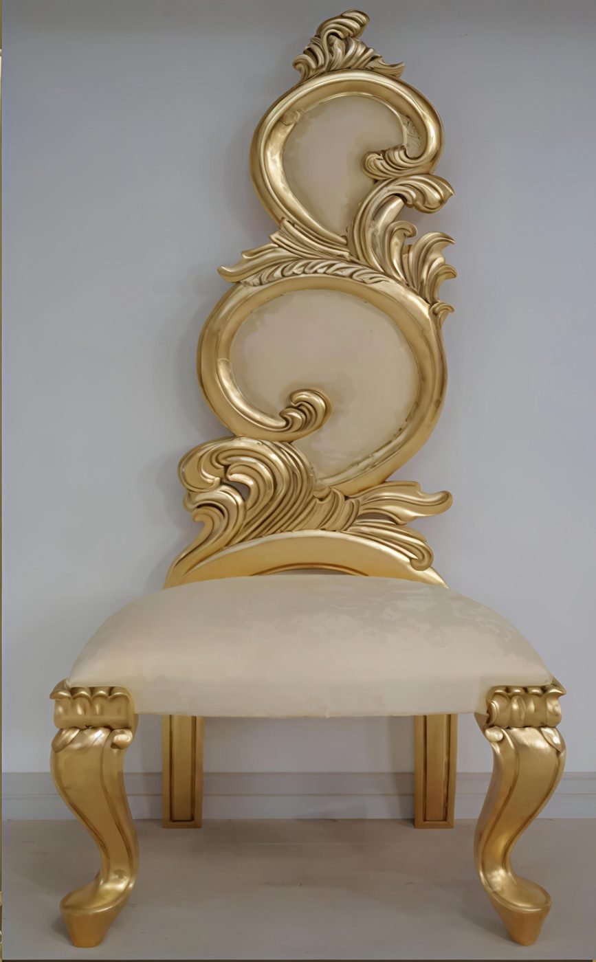 Gold leaf foil sheets applied on a carved wooden chair
