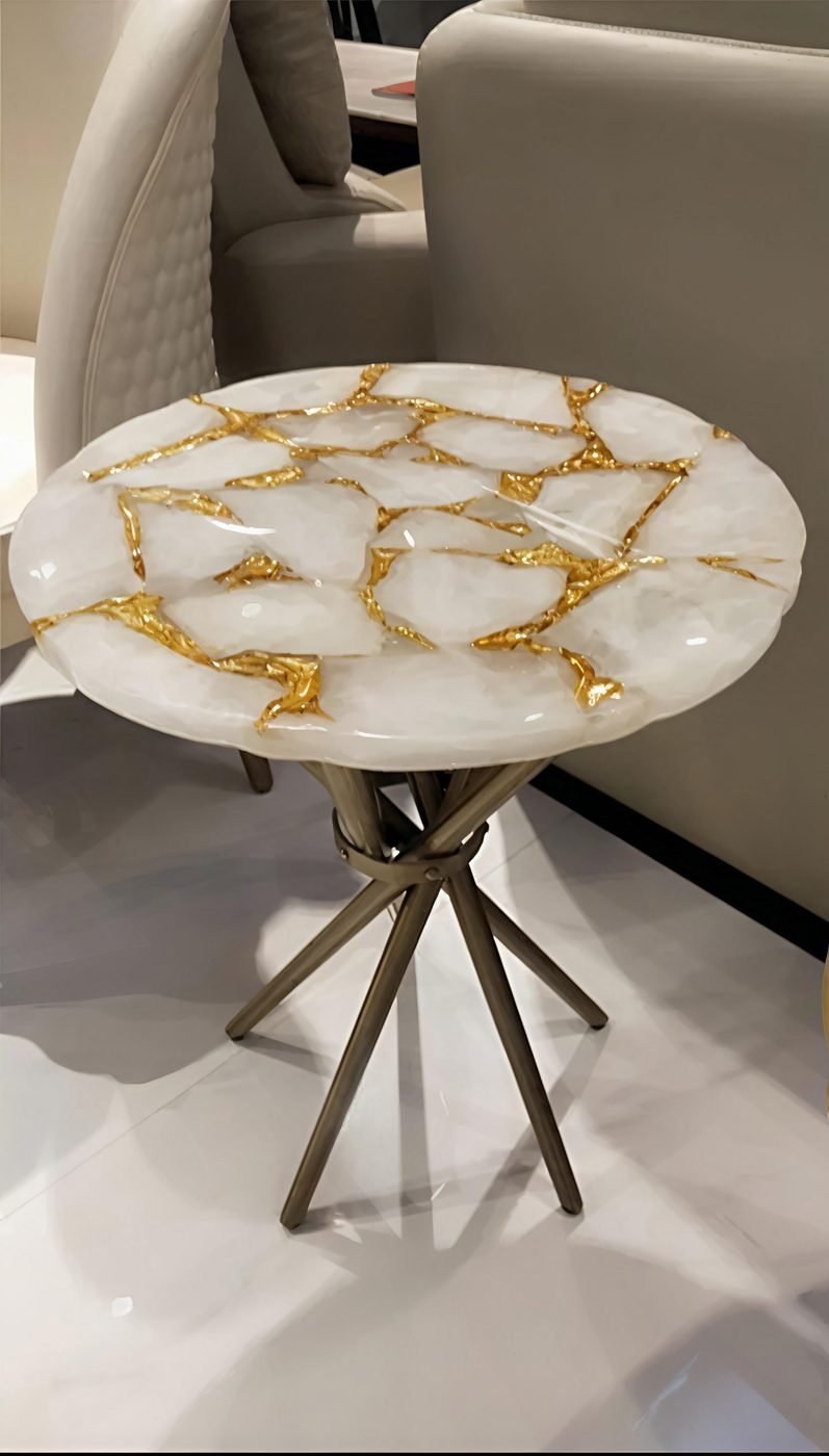 Gold leaf foil sheets used in a resin art side table top