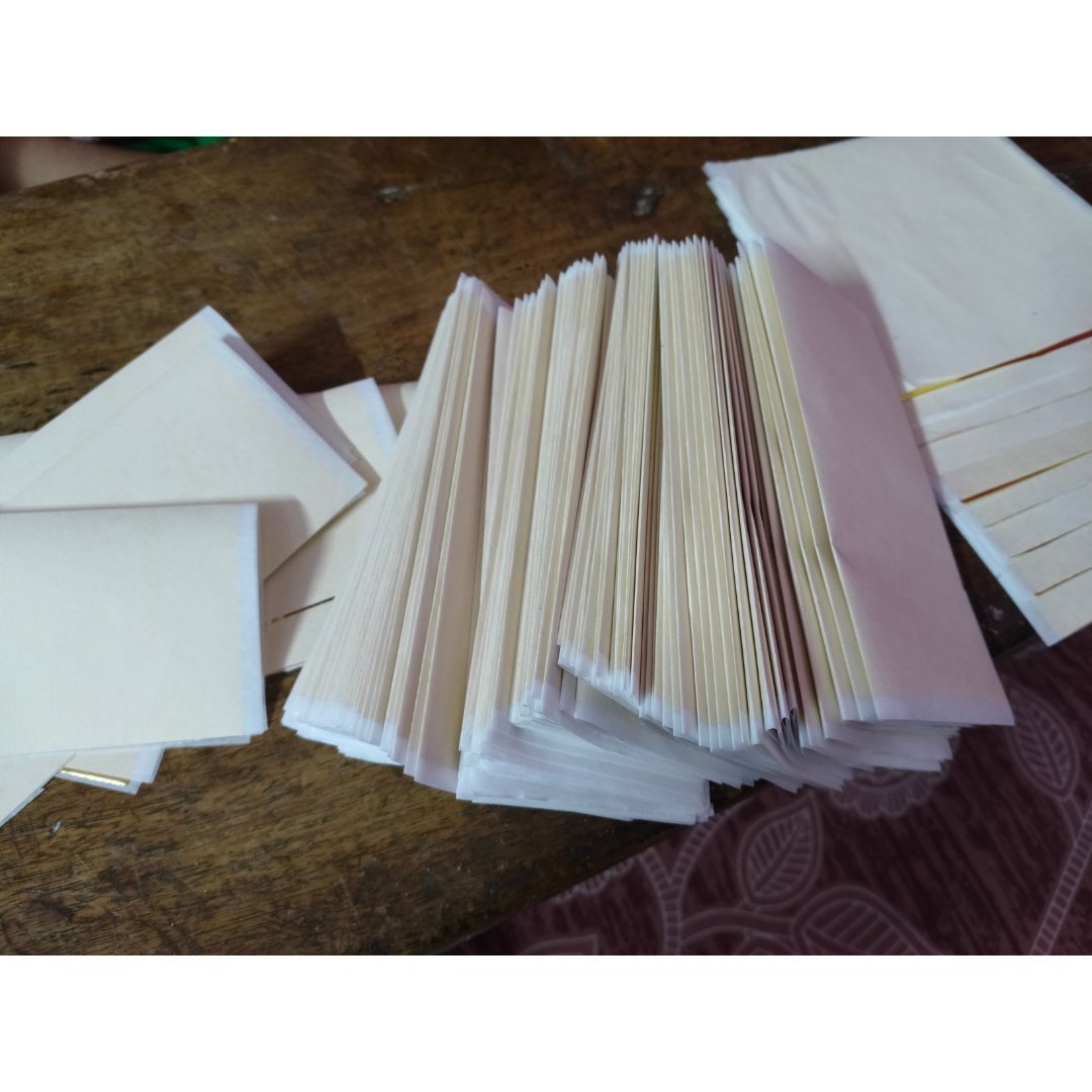Stacked gaddis of gold leaf foil sheets 14x14 cm