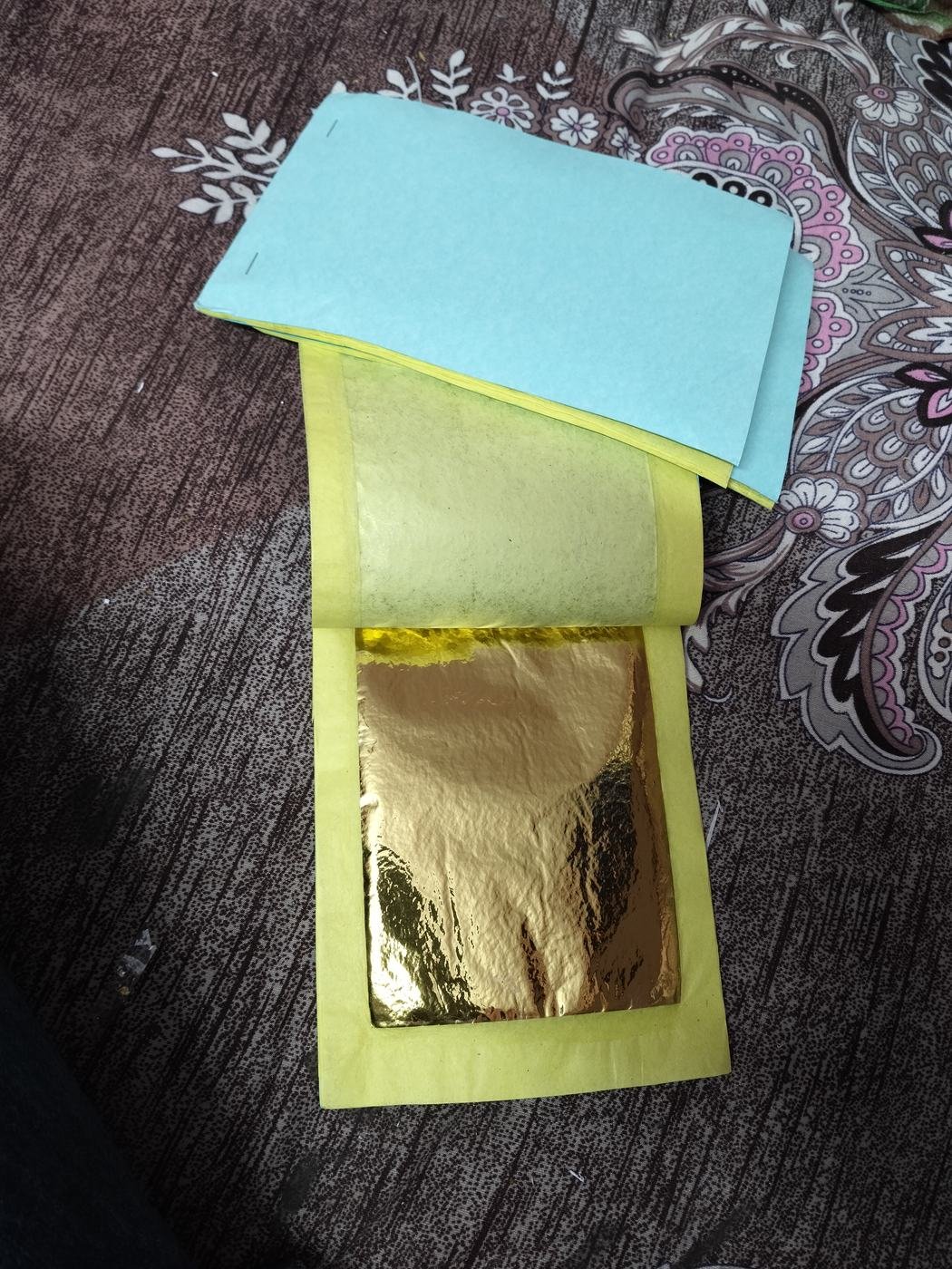 Open imitation gold foil book for Tanjore painting