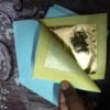 Tanjore painting gold foil sheet held in hand