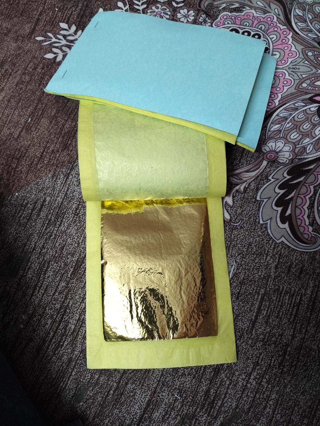 Stack of imitation gold foil books 4x6 inch
