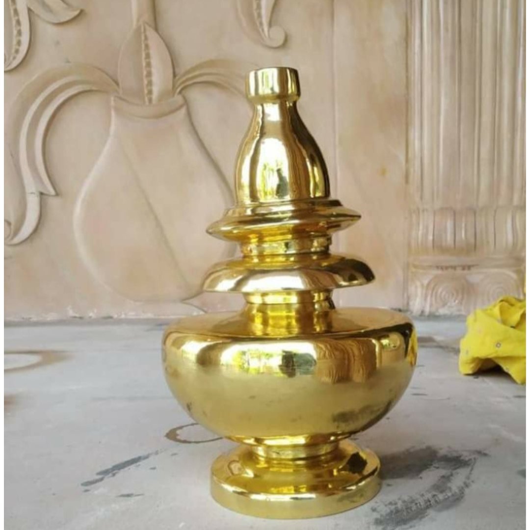 Gold plated mandir kalash on marble