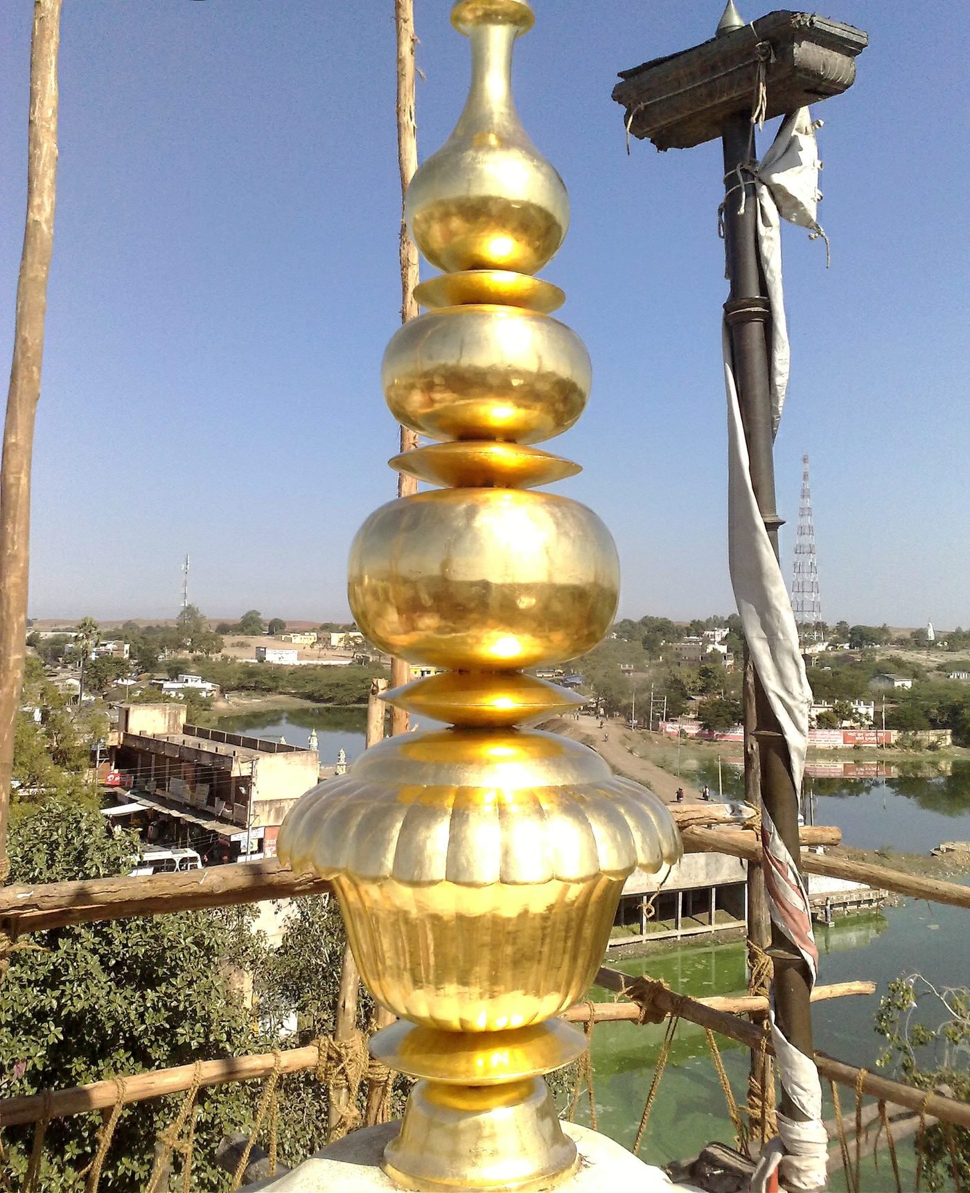 Gold leafing on mandir shikhar kalash by Sumera Warq at Ranapur MP