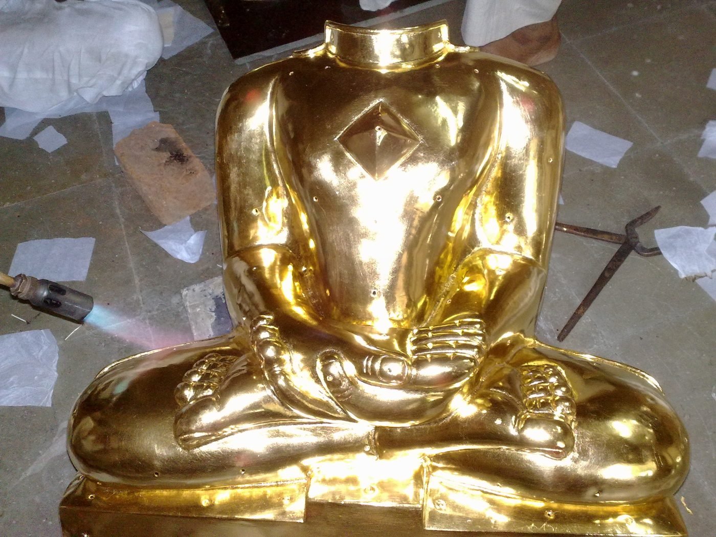 Close-up of 24K gold leaf applied by hand on a Jain murti
