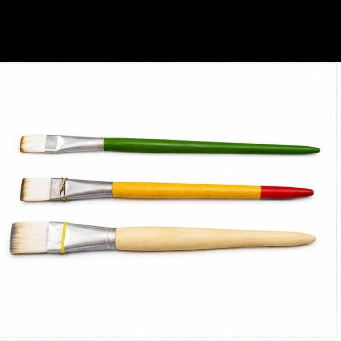 Set of 3 gold leafing brushes with green, yellow and wooden handles on white background - Sumera Warq