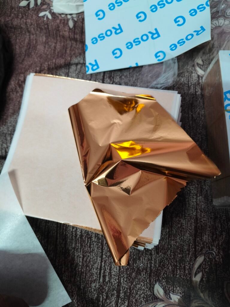 rose gold foil sheets booklet khula hua - tissue paper ke beech sheets